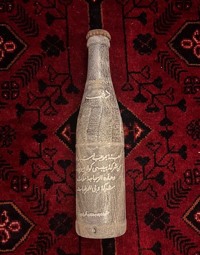 أمطار الإمارات تكشف عن زجاجة "كولا" عمرها 62 عاما (صور)